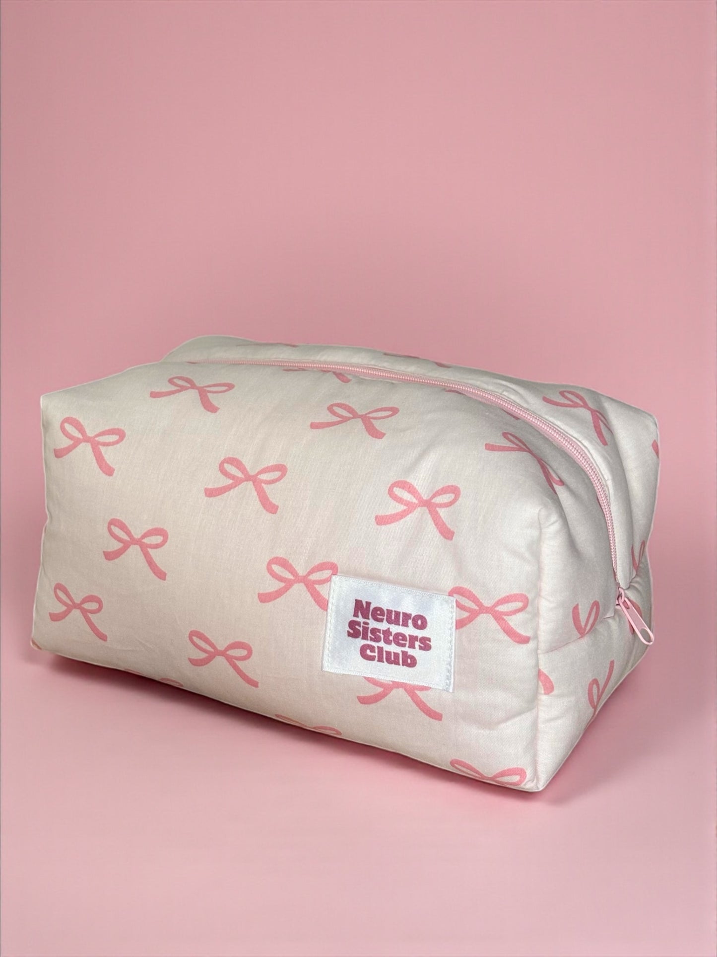 Trousse de toilette rose à noeud