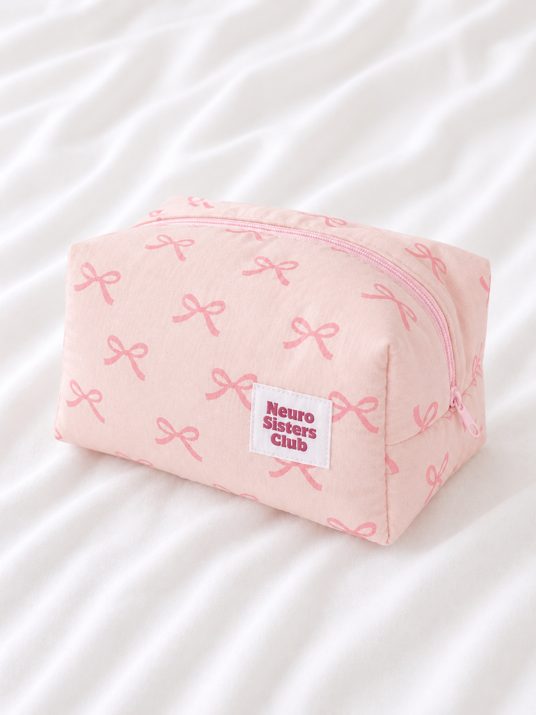 Trousse de toilette rose à noeud